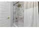 Updated bathroom featuring stylish tiling, a tub, and modern fixtures at 1505 Ezra Church Nw Dr, Atlanta, GA 30314