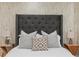 Primary bedroom with decorative wallpaper and soft lighting at 1505 Ezra Church Nw Dr, Atlanta, GA 30314