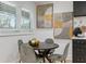 Comfortable dining area with round table, stylish chairs, and natural light through the window at 1505 Ezra Church Nw Dr, Atlanta, GA 30314