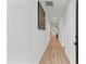 Hallway with hardwood floors, and multiple doors at 1505 Ezra Church Nw Dr, Atlanta, GA 30314