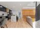 Modern kitchen with stainless steel appliances, kitchen island with marble countertops, and wood floors at 1505 Ezra Church Nw Dr, Atlanta, GA 30314