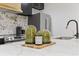 Kitchen features marble countertop, decorative accessories, and stainless steel appliances at 1505 Ezra Church Nw Dr, Atlanta, GA 30314