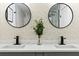 Elegant bathroom features dual sinks, decorative mirrors, and modern fixtures at 1566 Ezra Church Nw Dr, Atlanta, GA 30314