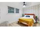 Bright bedroom with large windows, decorative accent wall, and wood-look floors at 1566 Ezra Church Nw Dr, Atlanta, GA 30314