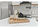 Gourmet kitchen featuring stainless steel appliances, quartz countertops, and custom cabinetry at 1566 Ezra Church Nw Dr, Atlanta, GA 30314