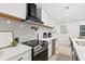 Modern kitchen features stainless steel appliances, quartz countertops and eat in dining at 1566 Ezra Church Nw Dr, Atlanta, GA 30314
