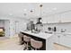 Modern kitchen features an island with marble countertops, pendant lights, and stainless steel appliances at 1566 Ezra Church Nw Dr, Atlanta, GA 30314