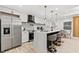 Modern kitchen with stainless steel appliances, quartz countertops and an island with seating at 1566 Ezra Church Nw Dr, Atlanta, GA 30314