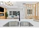 Open concept kitchen with stainless appliances, quartz countertops and breakfast bar at 1566 Ezra Church Nw Dr, Atlanta, GA 30314