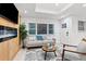 Bright living room with electric fireplace, light wood floors and neutral decor at 1566 Ezra Church Nw Dr, Atlanta, GA 30314