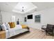 Spacious main bedroom boasts hardwood floors, recessed lighting, and a decorative headboard at 1566 Ezra Church Nw Dr, Atlanta, GA 30314