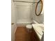 Bathroom featuring a toilet, bathtub, shower, vanity, and round mirror at 2340 Beaver Ruin Rd # Un37, Norcross, GA 30071
