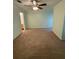 Spacious carpeted bedroom with ample natural light and ceiling fan at 2340 Beaver Ruin Rd # Un37, Norcross, GA 30071