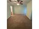 Spacious carpeted bedroom with ample natural light and ceiling fan at 2340 Beaver Ruin Rd # Un37, Norcross, GA 30071