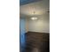 Spacious dining room with hardwood floors and hanging chandelier light fixture at 2340 Beaver Ruin Rd # Un37, Norcross, GA 30071