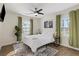 Sunlit bedroom featuring hardwood floors, decorative rug, and modern decor at 749 Bonnie Brae Sw Ave, Atlanta, GA 30310