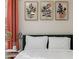 Close up of decorative art in the bedroom featuring a green headboard at 749 Bonnie Brae Sw Ave, Atlanta, GA 30310
