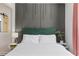 Charming bedroom boasting an accent wall, stylish headboard, and modern decor at 749 Bonnie Brae Sw Ave, Atlanta, GA 30310