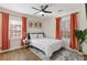 Inviting bedroom featuring hardwood floors, bright windows, modern decor, and neutral walls at 749 Bonnie Brae Sw Ave, Atlanta, GA 30310