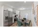Modern kitchen with stainless steel appliances, white cabinets, and a view to the dining and living areas at 749 Bonnie Brae Sw Ave, Atlanta, GA 30310
