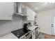 Well-lit kitchen with modern stainless steel appliances, white subway tile backsplash, and contemporary fixtures at 749 Bonnie Brae Sw Ave, Atlanta, GA 30310