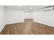 Finished basement area with modern flooring, recessed lighting, and a throughway to another space at 502 Bridge Se Ln, Smyrna, GA 30082