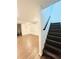 Finished basement area featuring laminate flooring, a modern staircase, built-in shelving and a partial bathroom at 502 Bridge Se Ln, Smyrna, GA 30082