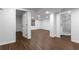 Finished basement featuring laminate flooring, a door to the outside, and a standup shower at 502 Bridge Se Ln, Smyrna, GA 30082