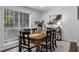 Bright dining room with a large window, a wooden dining table, and a minimalist design at 502 Bridge Se Ln, Smyrna, GA 30082