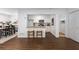 Open floor plan features a breakfast bar overlooking a fully updated kitchen with stainless steel appliances at 502 Bridge Se Ln, Smyrna, GA 30082