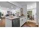 Updated kitchen boasts stainless steel appliances, granite countertops, and an open layout to dining and living spaces at 502 Bridge Se Ln, Smyrna, GA 30082