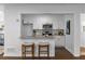Open kitchen view showcases stainless steel appliances, granite countertops, and breakfast bar seating at 502 Bridge Se Ln, Smyrna, GA 30082