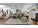 Cozy living room with a stylish rug, comfortable sofa, and fireplace, creating a relaxing ambiance at 502 Bridge Se Ln, Smyrna, GA 30082