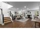 Spacious living room offers ample seating, fireplace, and seamless flow to the dining area and kitchen at 502 Bridge Se Ln, Smyrna, GA 30082