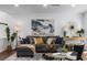 Bright and airy living room with modern decor, a plush sofa, and ample natural light at 502 Bridge Se Ln, Smyrna, GA 30082