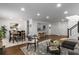 Open-concept living area with dining, kitchen views, and hardwood floors for easy flow at 502 Bridge Se Ln, Smyrna, GA 30082