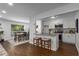 Open living space with a modern kitchen bar, dining area, and comfortable seating arrangement at 502 Bridge Se Ln, Smyrna, GA 30082