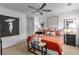 Stylish bedroom with ceiling fan, neutral walls and carpet, decorative pillows, and modern artwork at 502 Bridge Se Ln, Smyrna, GA 30082