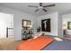 Stylish bedroom with ceiling fan, neutral walls and carpet, decorative pillows, and modern artwork at 502 Bridge Se Ln, Smyrna, GA 30082