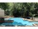 View of a community pool with lounge chairs and tables nearby at 502 Bridge Se Ln, Smyrna, GA 30082