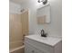 Bathroom featuring a shower-tub combo and single sink vanity at 5861 Community Rd, Mableton, GA 30126