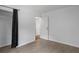 Bright bedroom with wood-look flooring, an open doorway, and natural light at 5861 Community Rd, Mableton, GA 30126