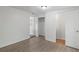 This bedroom features modern wood-look flooring and a large closet for ample storage at 5861 Community Rd, Mableton, GA 30126