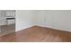 Comfortable living room featuring wood floors and access to a kitchen area at 5861 Community Rd, Mableton, GA 30126