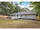 Home's backyard featuring a small deck and fenced in yard at 6211 Ward Rd, Union City, GA 30291