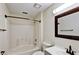 Bathroom with a shower and tub combination and a vanity with a framed mirror at 6211 Ward Rd, Union City, GA 30291