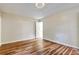 Bedroom featuring hardwood flooring, neutral wall colors, and ceiling light at 6211 Ward Rd, Union City, GA 30291
