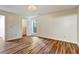 Bedroom featuring hardwood flooring, a closet, neutral wall colors, and a ceiling light at 6211 Ward Rd, Union City, GA 30291