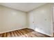 Bedroom featuring wood-look floors and a door to access closet or bathroom at 6211 Ward Rd, Union City, GA 30291