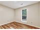 Bedroom with wood-look floors and a window that overlooks the driveway at 6211 Ward Rd, Union City, GA 30291